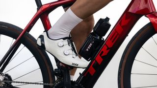 Close up of a rider's foot, riding aboard the Trek Domane+ SLR