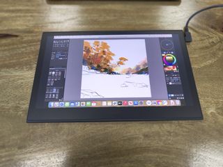 Wacom Movink review; a pen display on a wooden table