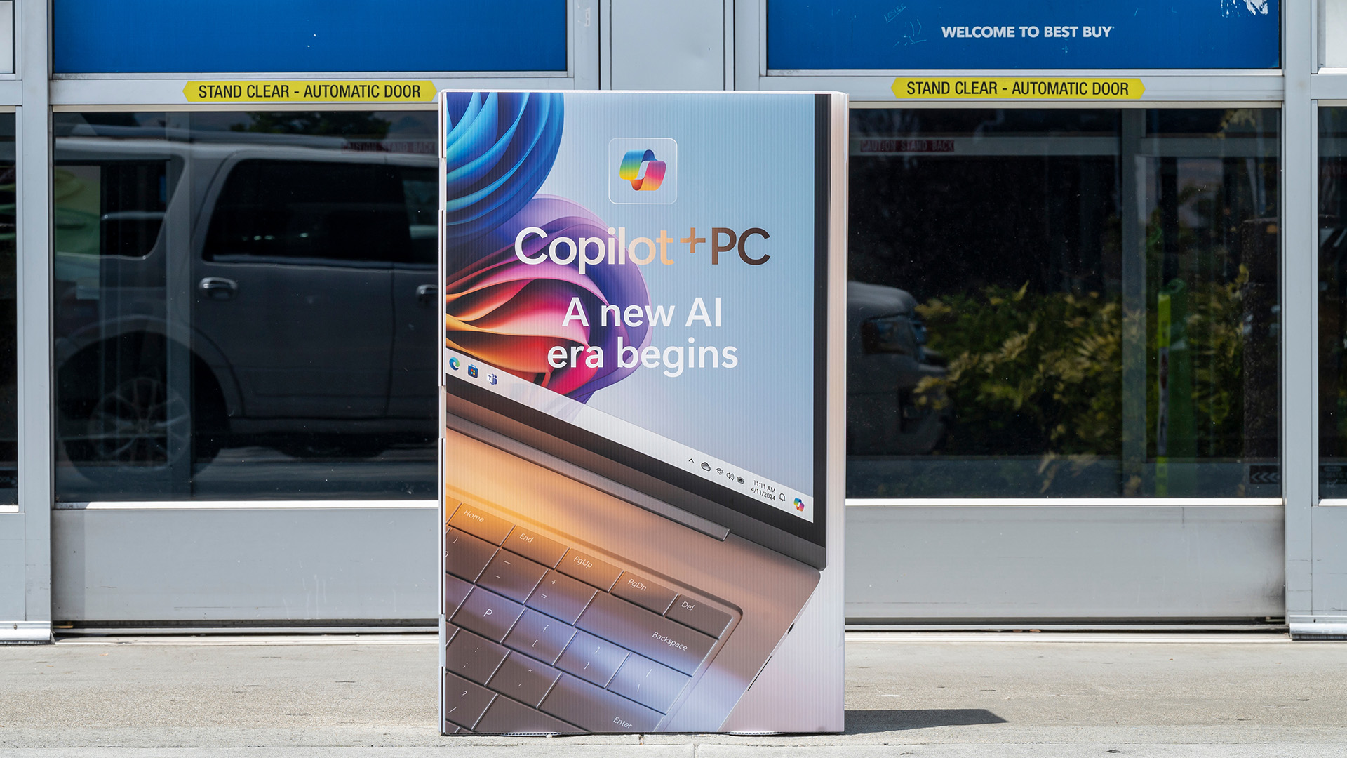 Signage for Microsoft Copilot+ PC outside a Best Buy store.