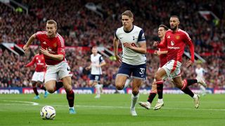 Micky van de Ven of Tottenham Hotspur and Matthijs de Ligt of Manchester United in action during the Premier League match between Manchester United FC and Tottenham Hotspur FC at Old Trafford on September 29, 2024 in Manchester, England.