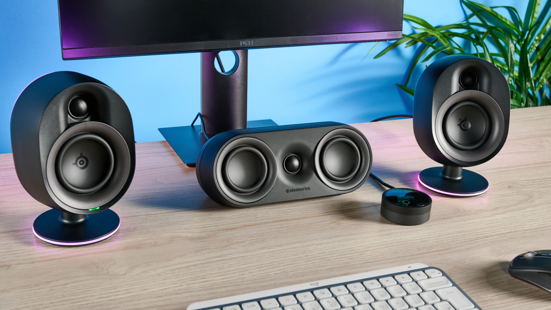 The SteelSeries Arena 9 front and central speakers on a computer desk