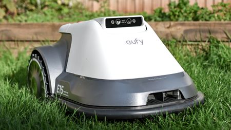 The Eufy E15 robot lawnmower in use on a lawn
