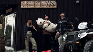 Kisa MTB Park build team and a massive dog