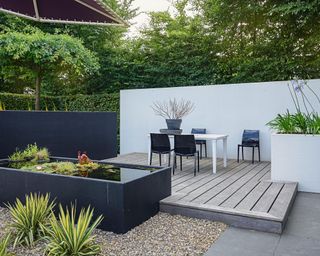modern garden design with water feature and gravel