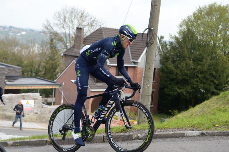 A Movistar rider gets out of the saddle