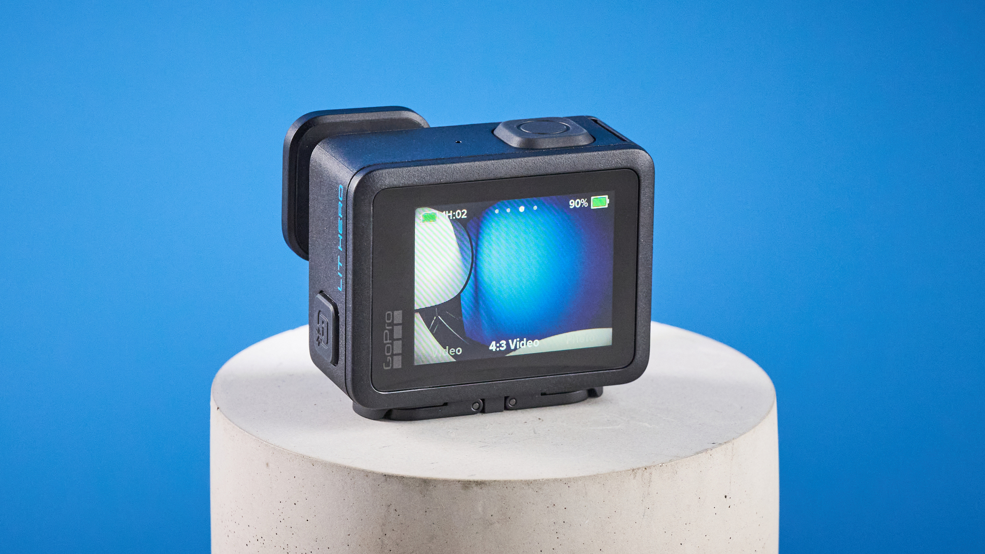 The GoPro LIT Hero against a blue background