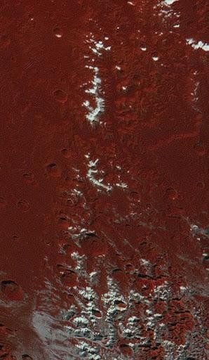 Water-ice mountains capped by frozen methane, as spotted by NASA's New Horizons spacecraft during its flyby of Pluto in July 2015.
