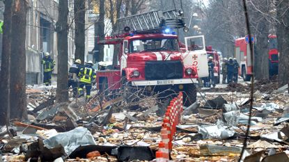 Emergency services try to deal with the destruction in Kharkiv