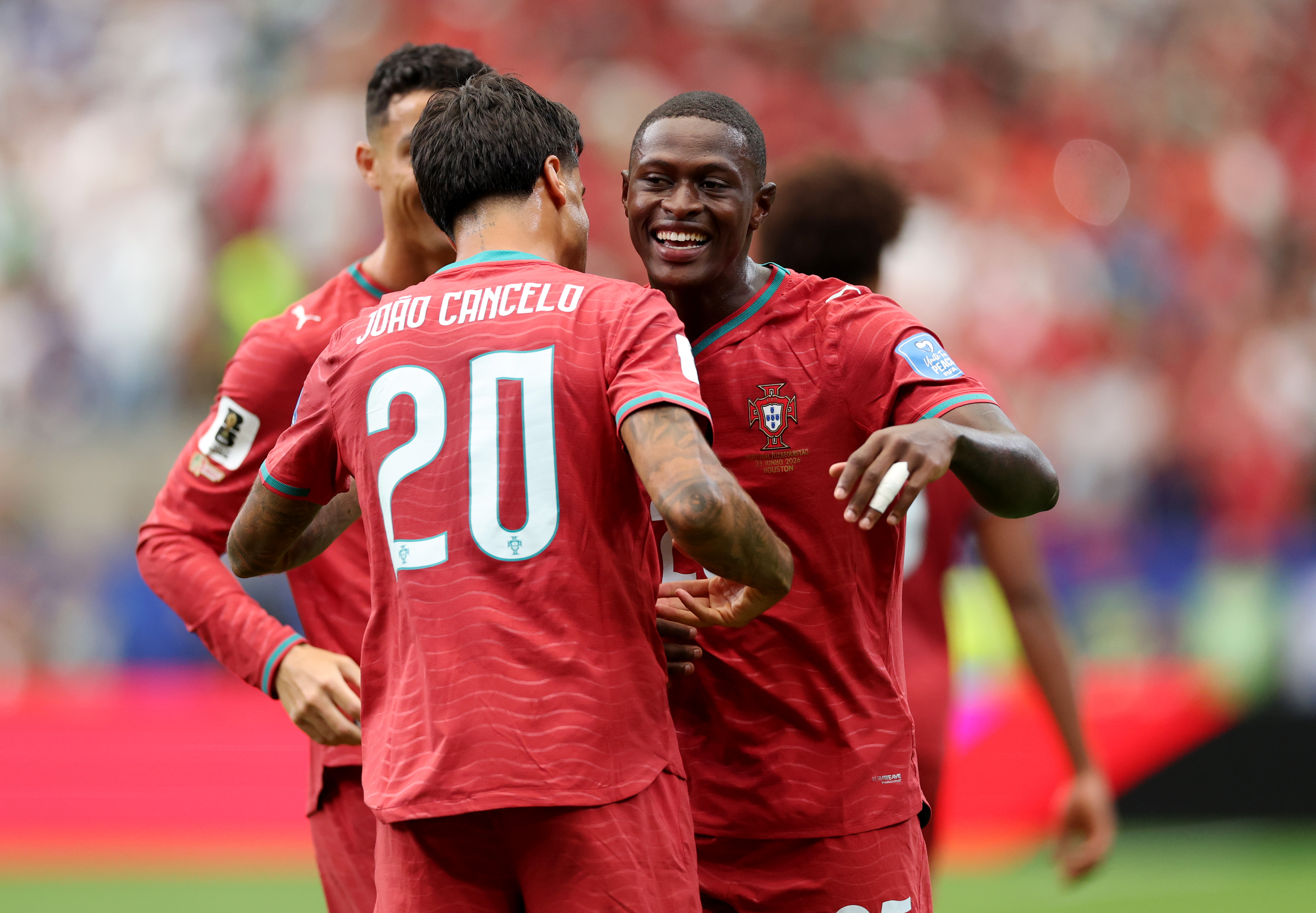 Joao Cancelo and Nuno Mendes celebrate for Portugal vs Uzbekistan at World Cup 2026