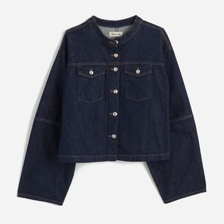 A cutout of a dark denim collarless jacket from Madewell