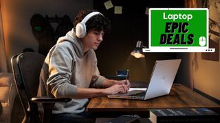 Student sitting at desk using Razer Blade laptop while wearing a Razer Opus X headphones