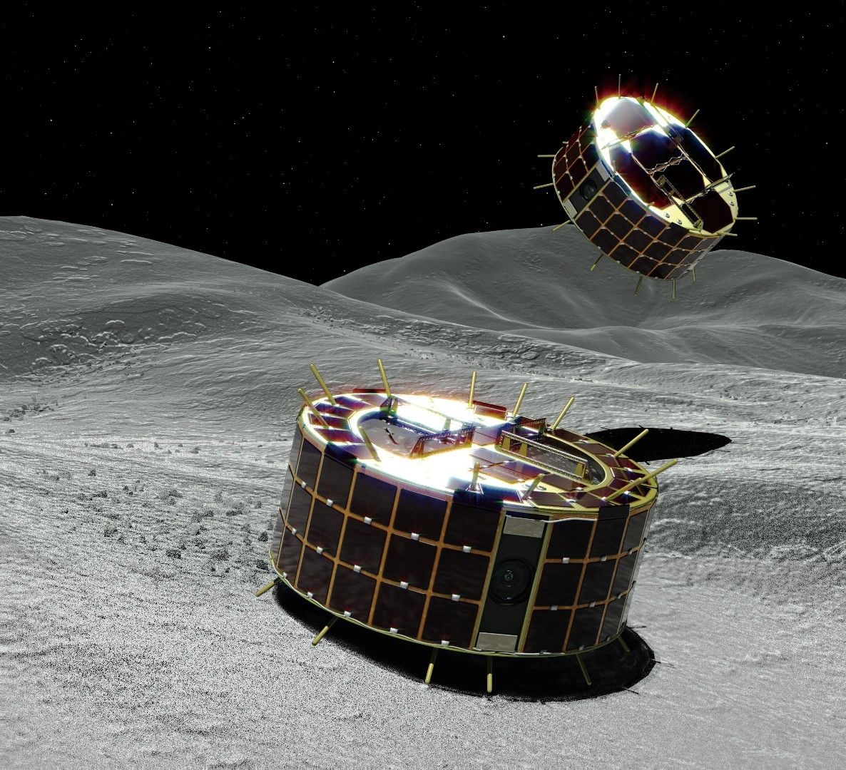 An artist's illustration of Hayabusa2's MINERVA-II1A and MINERVA-II1B rovers exploring the surface of the asteroid Ryugu. The little robots hop by rotating an internal torquer that sits atop a turntable.