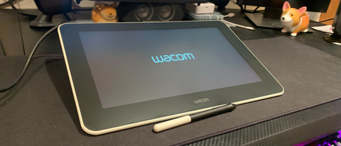 The Wacom One on a desk, turning on 