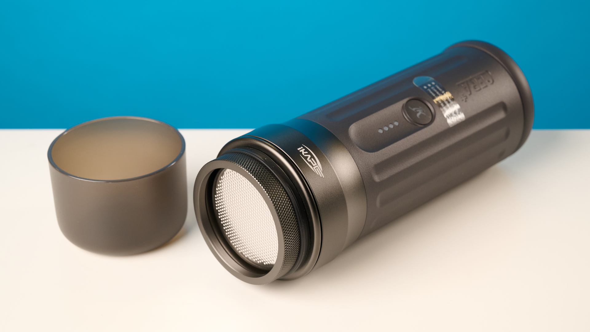 the ikape kapo k2 pro portable coffee maker against a blue background