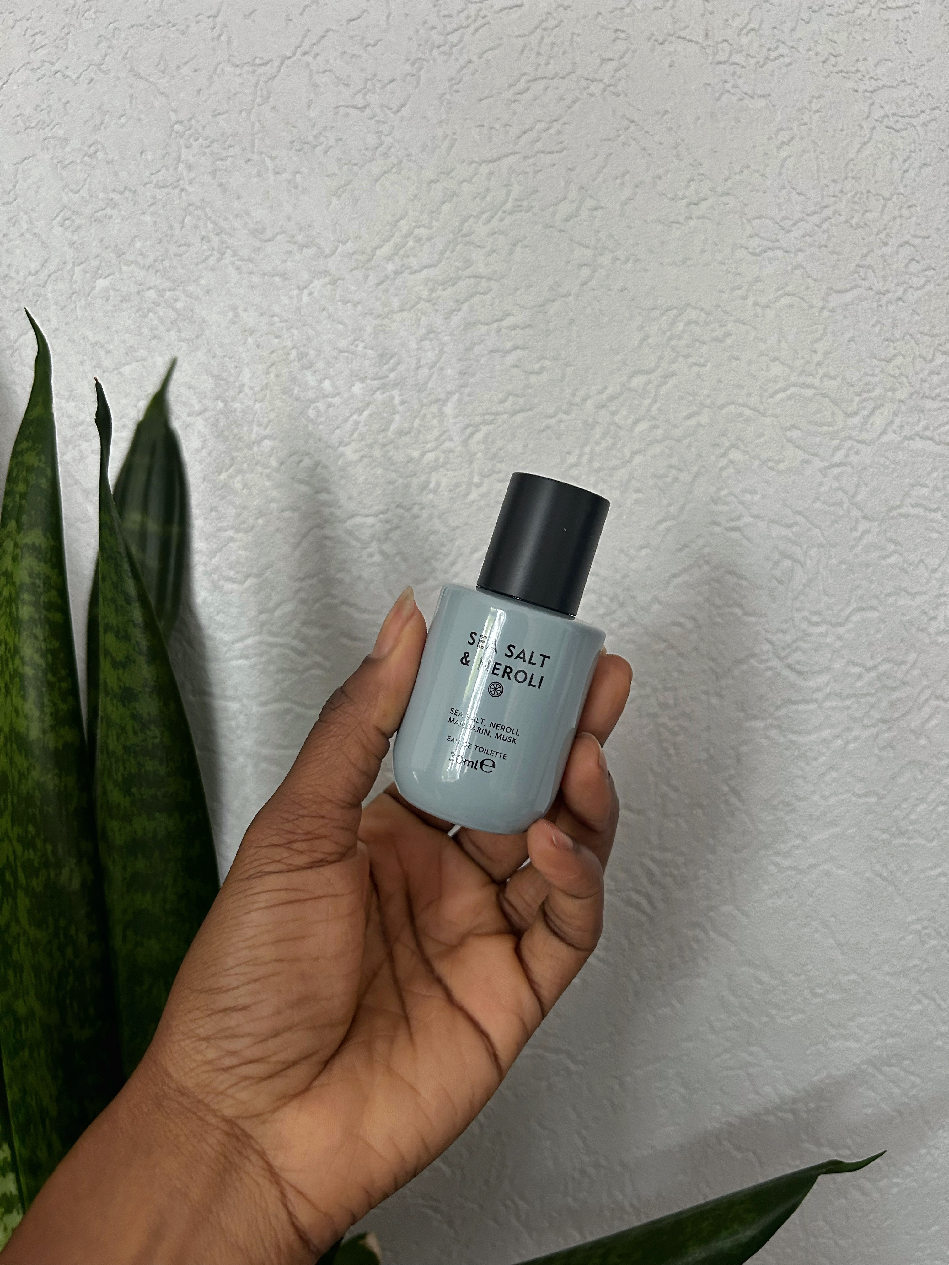 hand holding m&s perfume