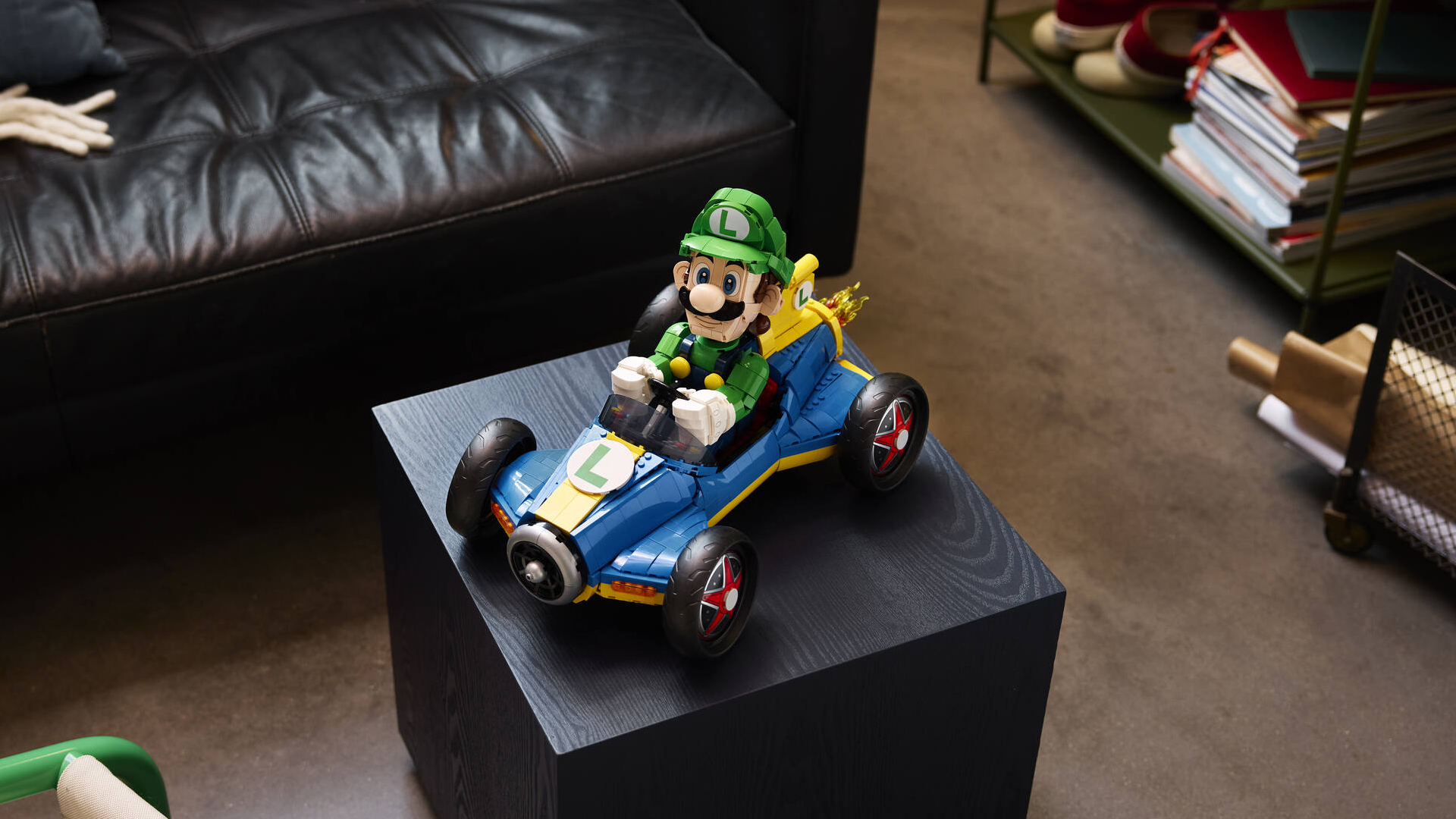 Lego Luigi & Mach 8 set on a black coffee table, looking up