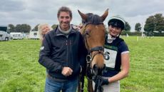 Tabitha Taylor, mother Amanda and father Jeremy, with a horse at an event