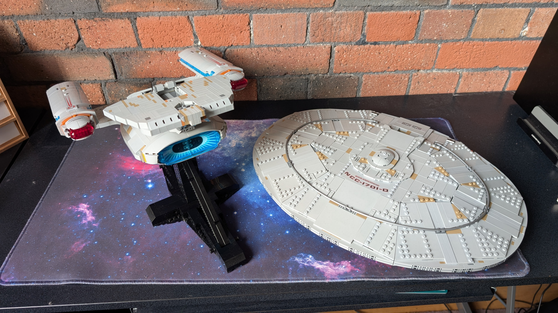 Lego U.S.S. Enterprise set on stand, with the saucer section detached