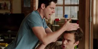 Schmidt trying to squeeze the conditioner out of Nick's hair in New Girl.