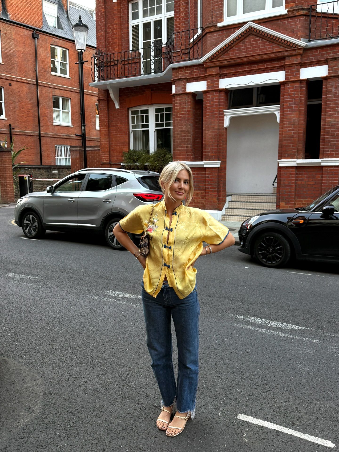 Woman wearing raw-hem, straight-leg jeans.