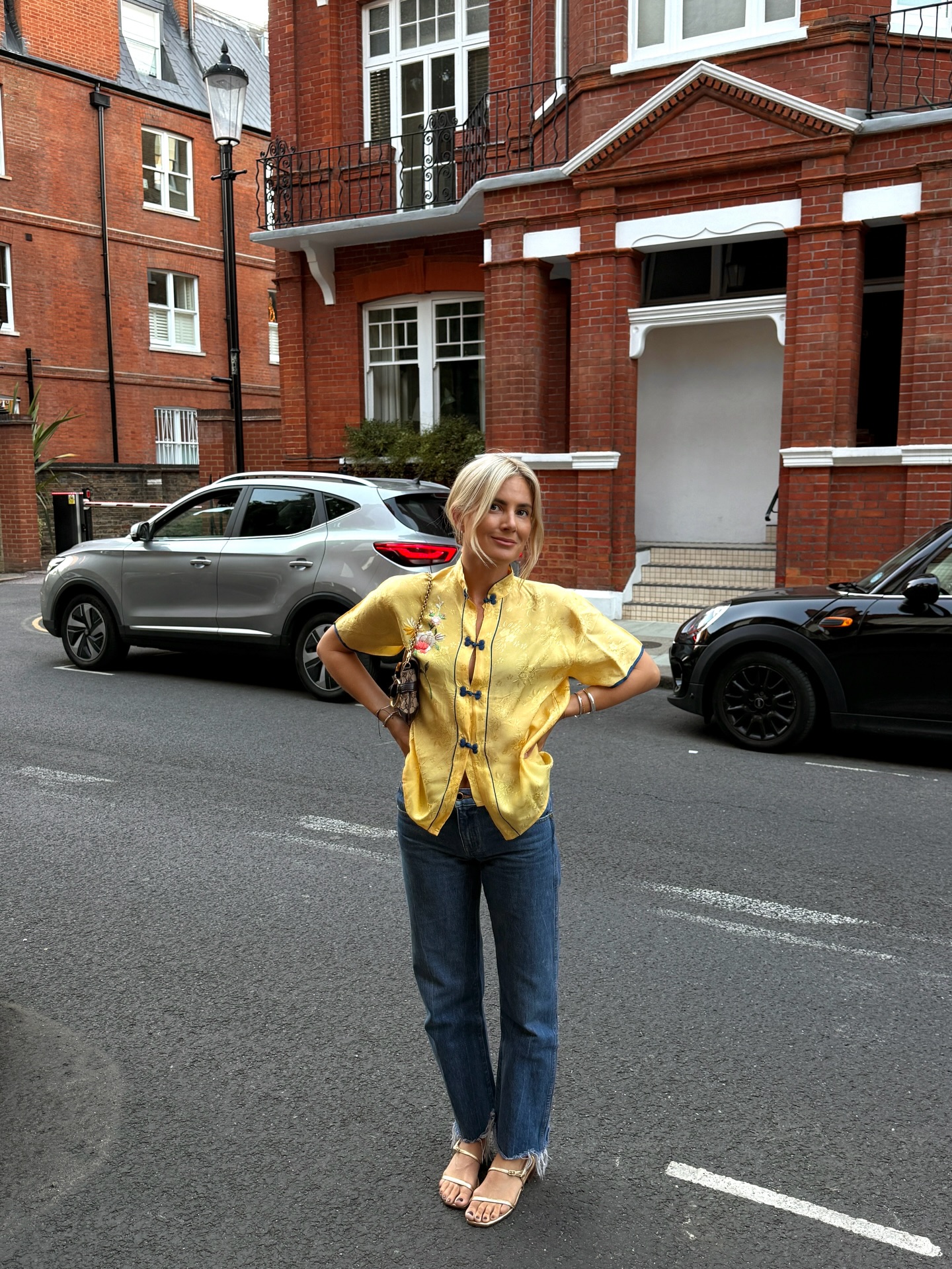 Woman wearing raw-hem, straight-leg jeans.