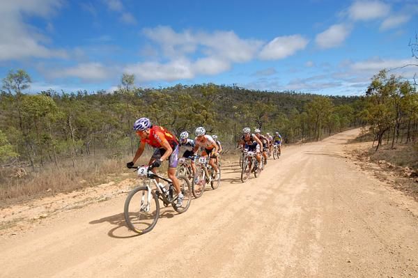 A group heads down the dry and dusty trail to