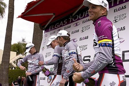 These guys are gunna cop some champers: Tour winner Jonathan Cantwell prepares to spray his teammates with champagne on the podium in Mildura.