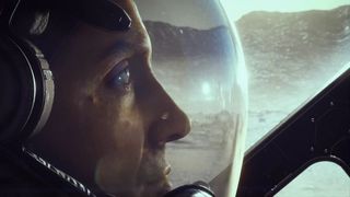 Starfield - A person in a space suit looks out from inside a starship
