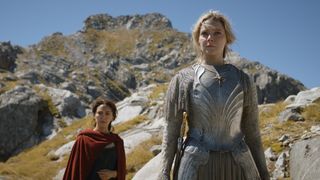 (L to R) Nazanin Boniadi (Bronwyn) and Morfydd Clark (Galadriel) on a cliff in Rings of Power episode 7