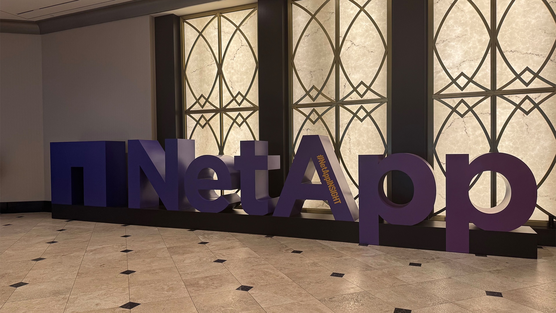 An image of NetApp's purple, freestanding 3D logo as you walk into the conference center