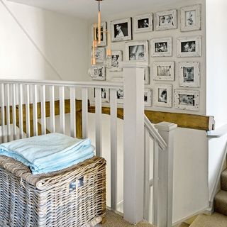 stair area with wooden basket and towel