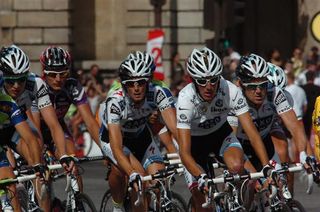 Andy and Frank Schleck ride together alongside Saxo Bank teammate, Stuart O'Grady, on the Tour's final stage