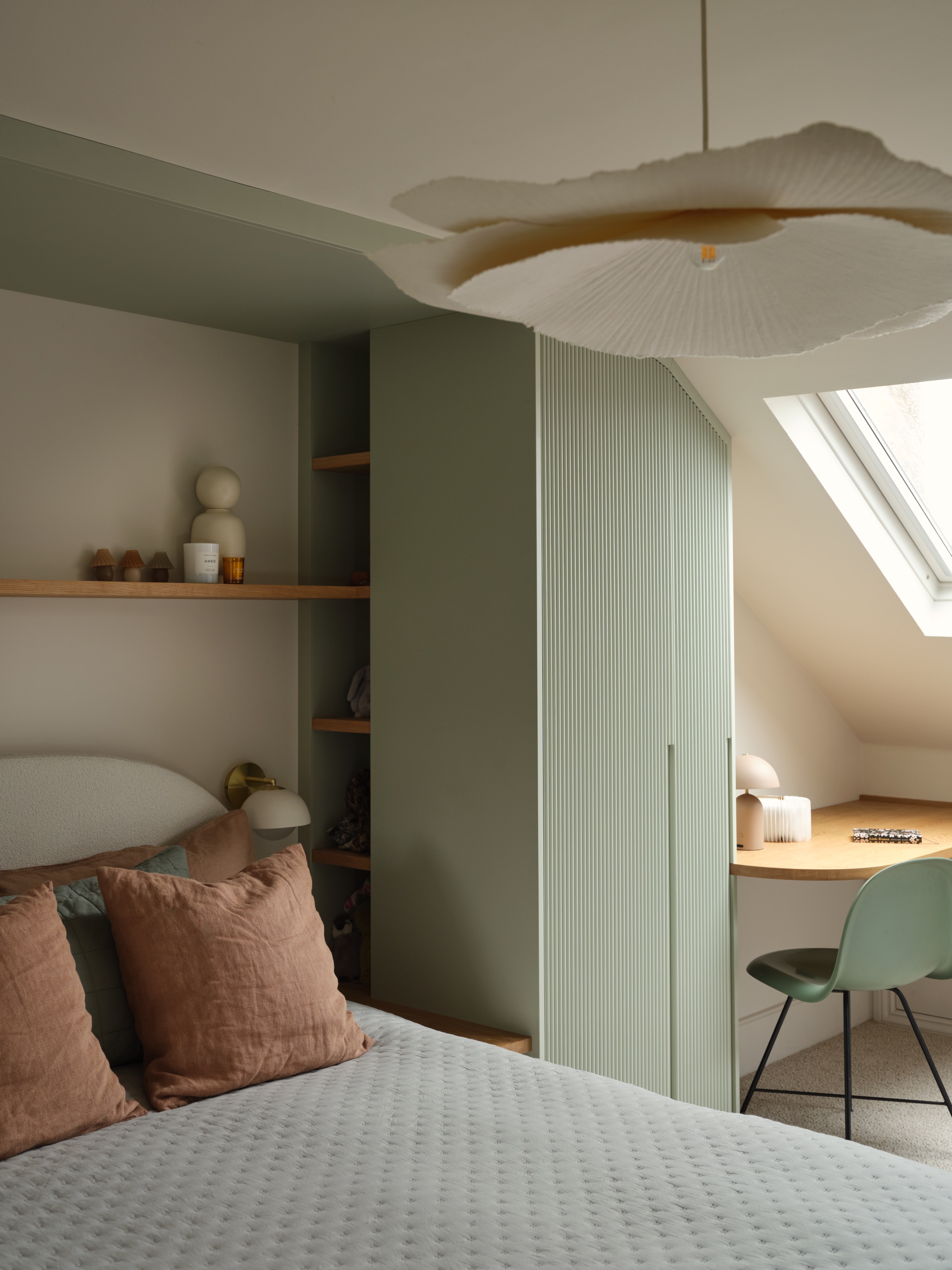 Bedroom with built-in storage in fluted green finish