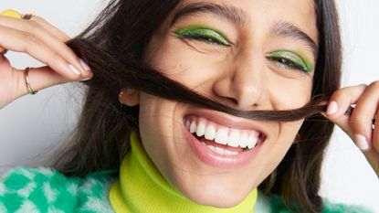 a girl smiling - how often to wash hair