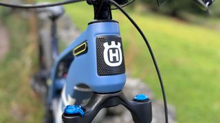 Husqvarna MC5 headtube badge with logo and cooling vents