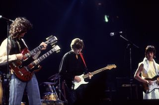 (from left) Jimmy Page, Eric Clapton and Jeff Beck perform at an ARMS concert in Dallas, Texas on November 27, 1983