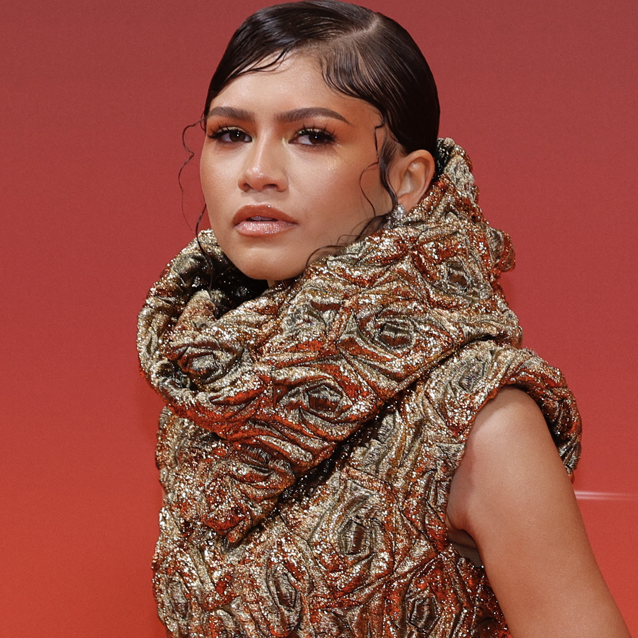 zendaya wears a gold cowl neck on the red carpet at dune 2 premiere