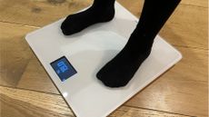 Withings Body smart scale being used by Live Science contributor Maddy Bidulph