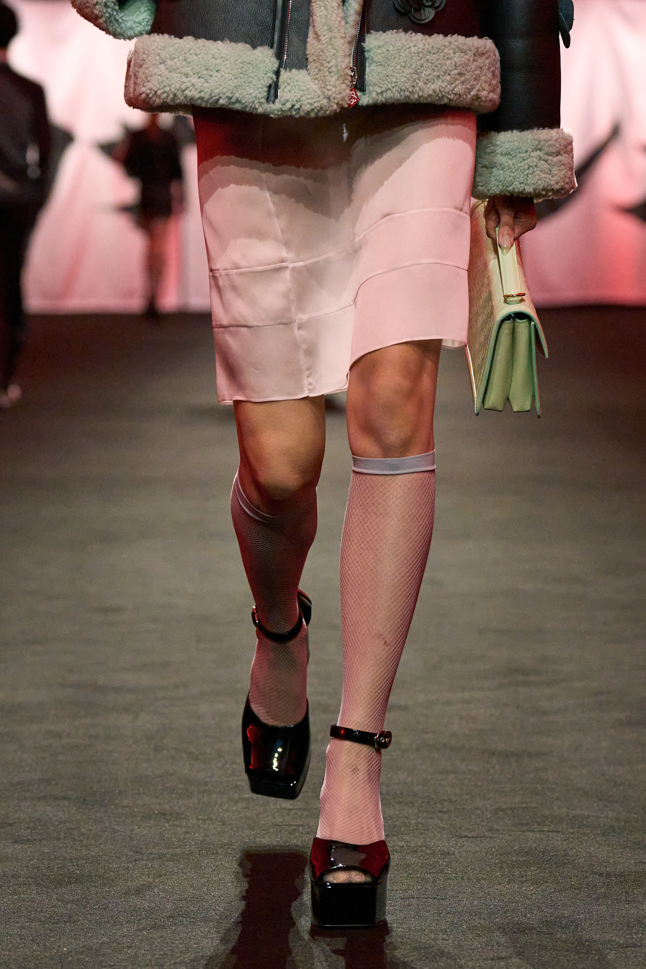 Image of the Casablanca autumn/winter runway 2025. The model wears a sheer knee-length skirt.