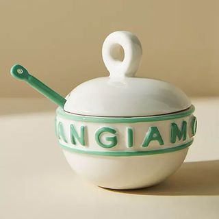 White and teal sugar pot with matching spoon and italian motif.