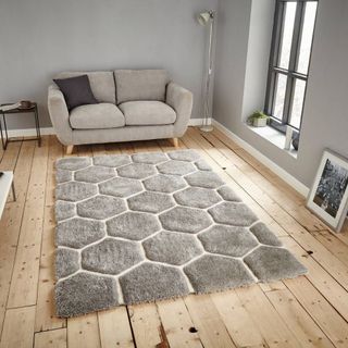 La Redoute So'Home Hand Carved Hexagon Rug on wooden floors