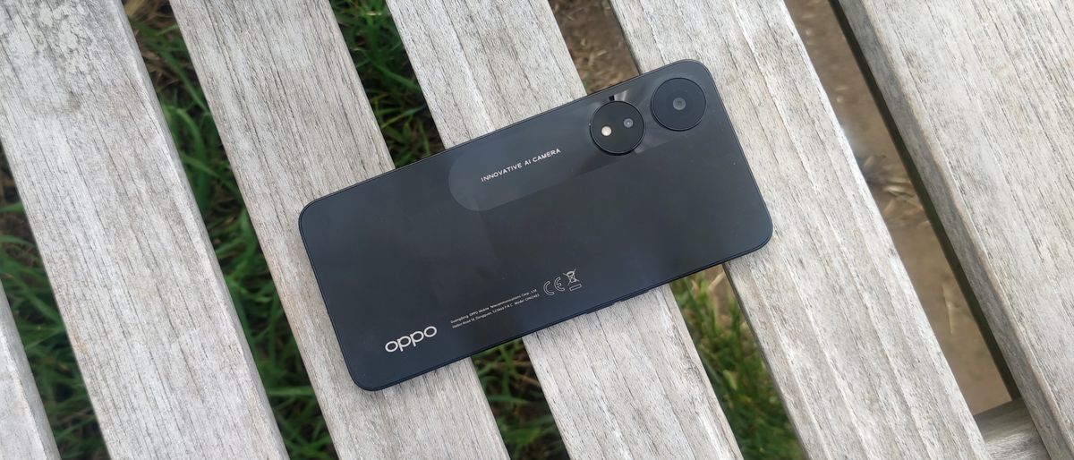 The Oppo A78 laid down on a bench