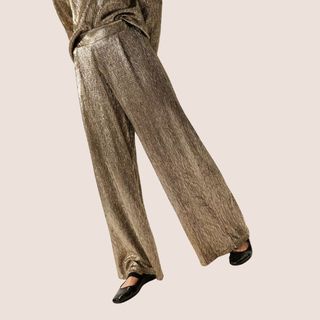 flat lay image of gold trousers