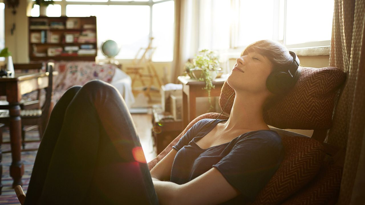 Woman wearing headphones and listening to music