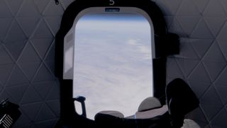 The view from a seat on Blue Origin's New Shepard Spacecraft First Step during a suborbital test flight on April 14, 2021.