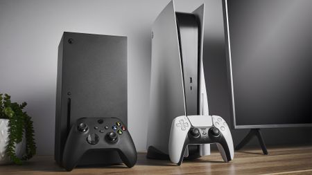 Xbox Series X and PS5 next to each other on a desk.