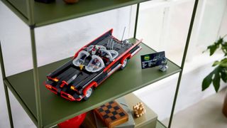 Lego Classic Batmobile and Batman minifigure on a green shelf, seen from above