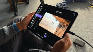 An Apple iPad Pro OLED showing a rock climbing video