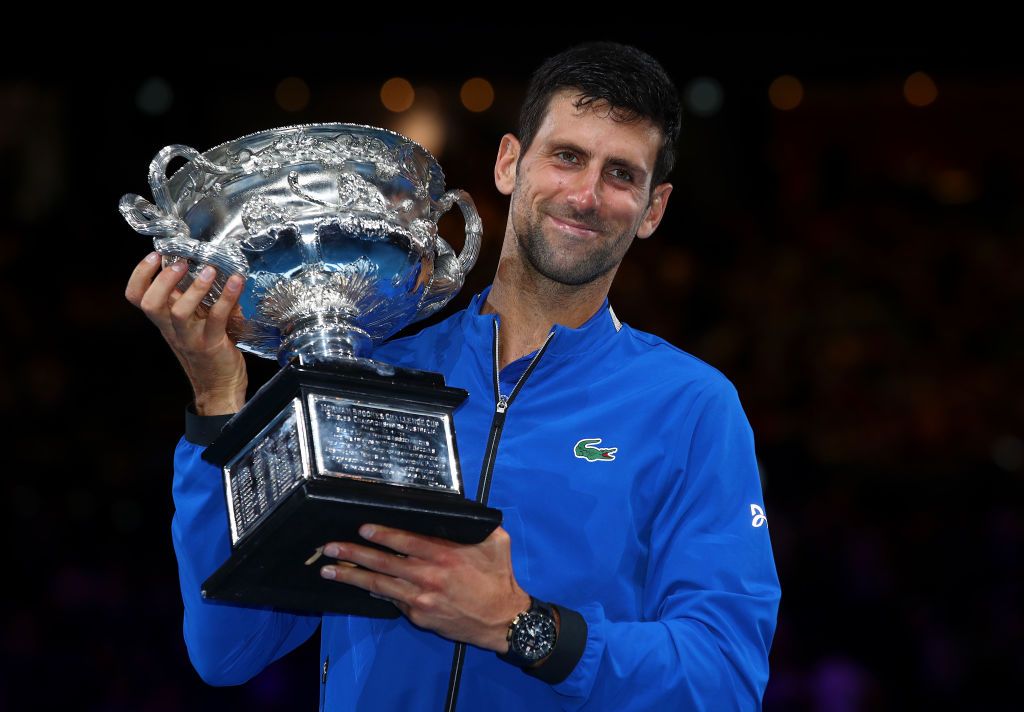 Novak Djokovic of Serbia poses with the Norman Brookes Challenge Cup following victory in his Men&amp;#039;s Singles Final match against Rafael Nadal of Spain during day 14 of the 2019 Australian Open