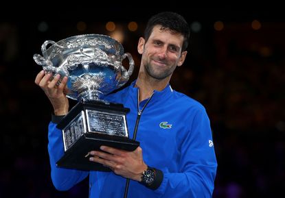 Novak Djokovic of Serbia poses with the Norman Brookes Challenge Cup following victory in his Men's Singles Final match against Rafael Nadal of Spain during day 14 of the 2019 Australian Open